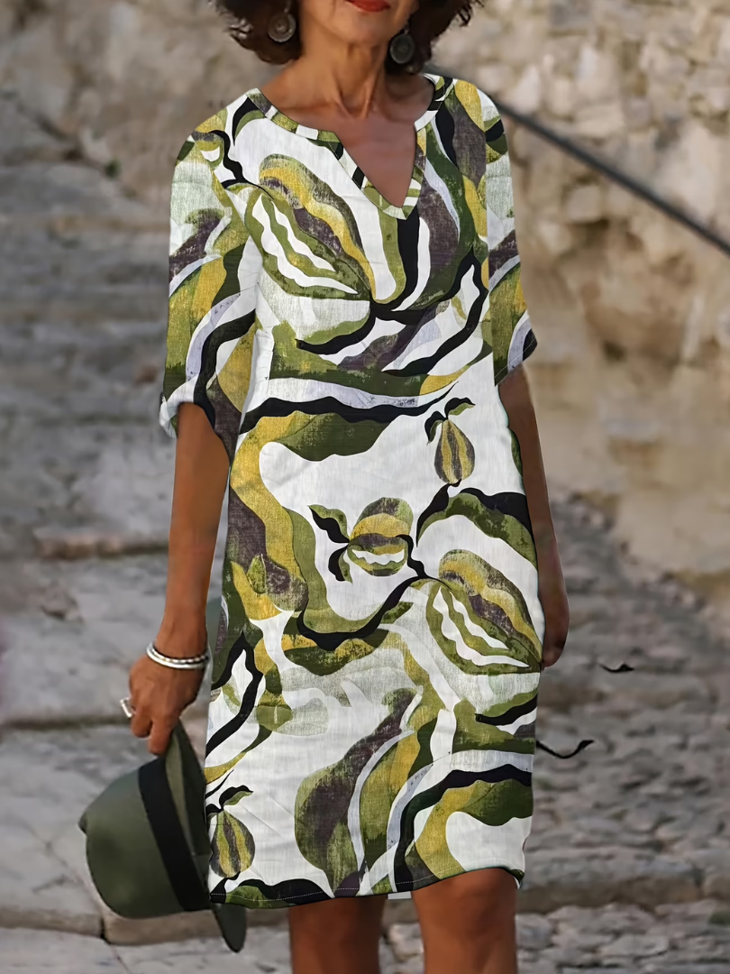 Susan dress front view, subtle V-neckline and half-length sleeves