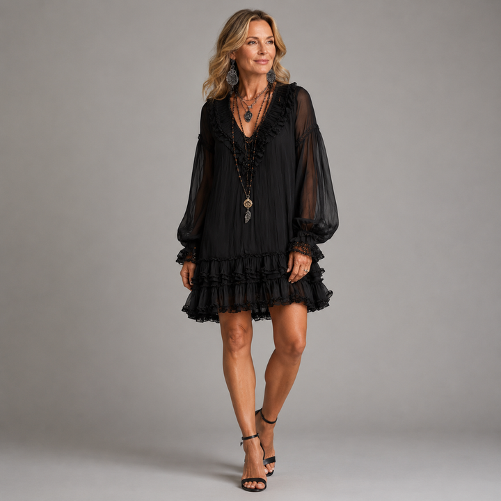 Nadine ruffled short dress front view showing V-neck and flowing skirt