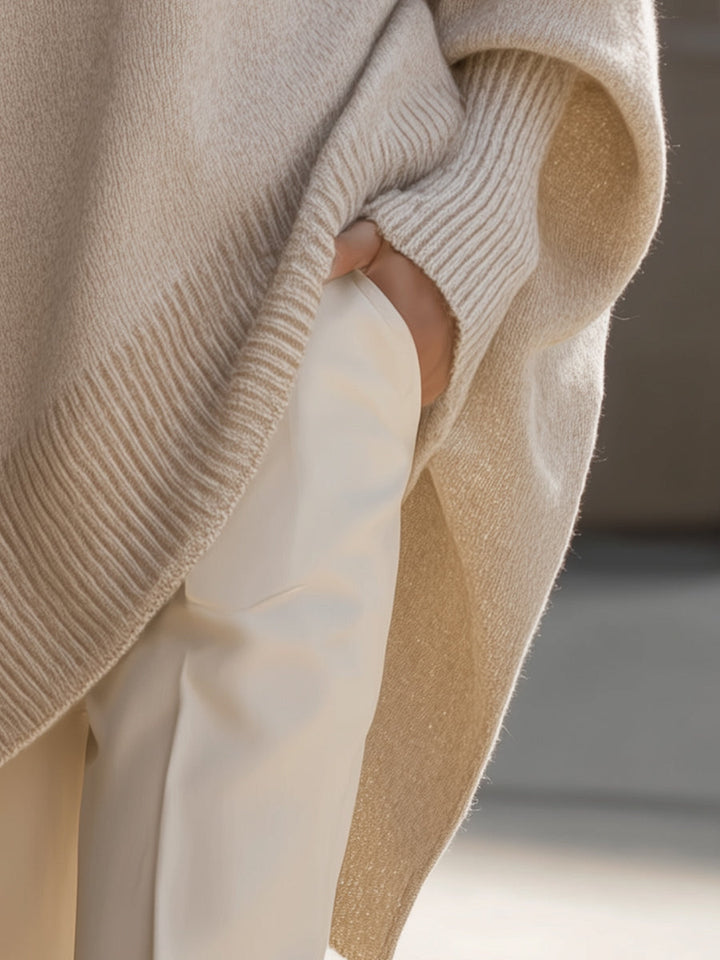Doreen oversized soft sweater in beige, detail of relaxed sleeve and hem drape