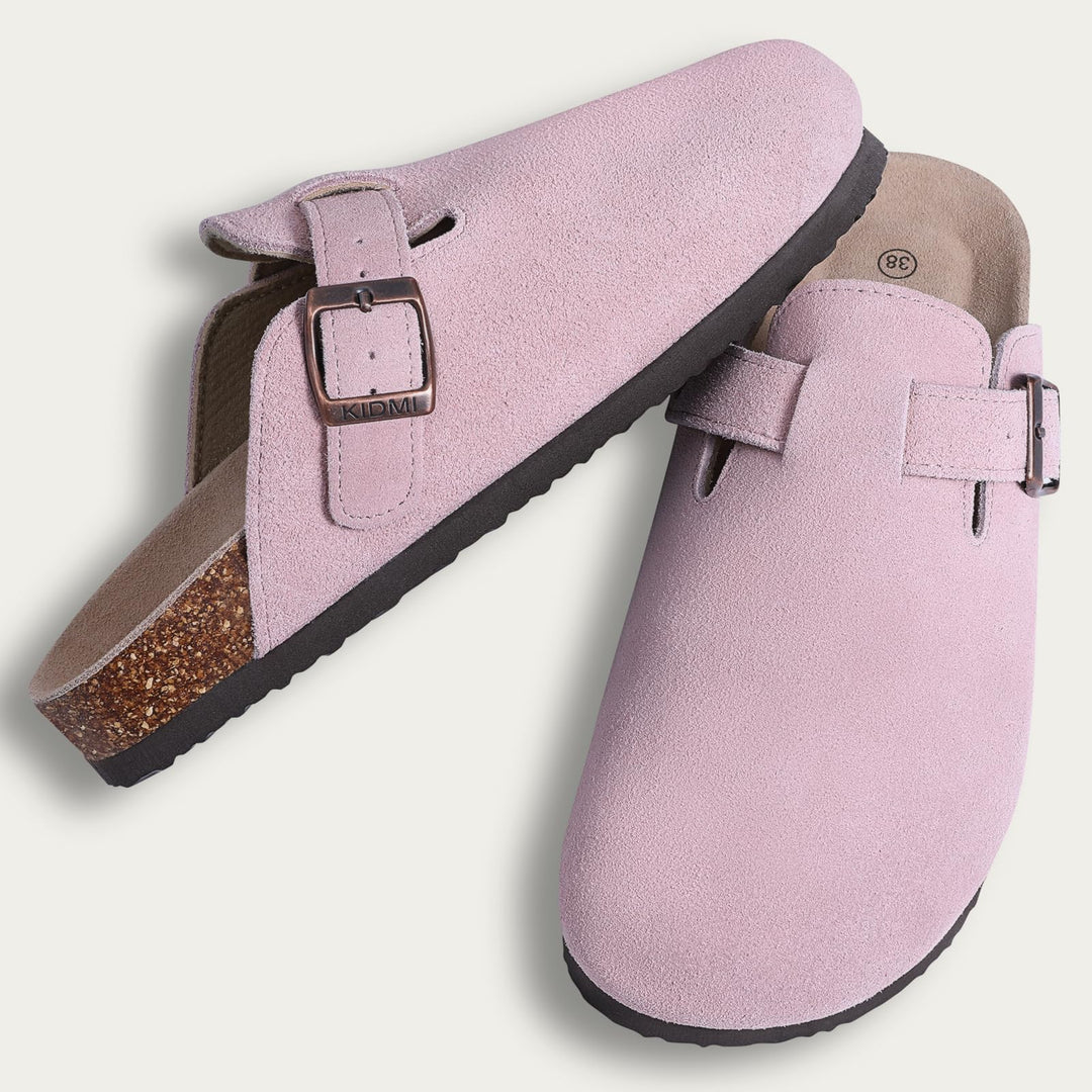 Riley suede ergonomic clogs worn outdoors