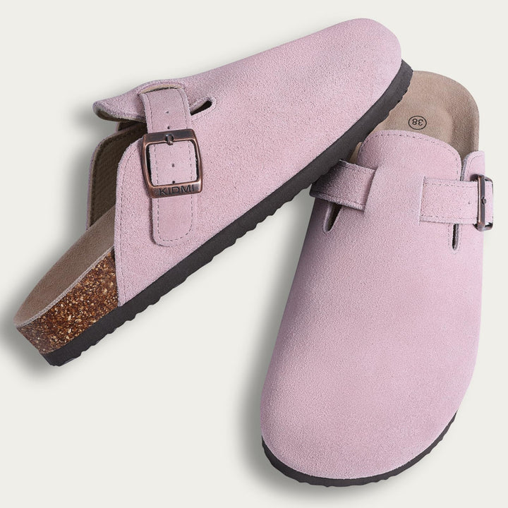 Riley suede ergonomic clogs worn outdoors