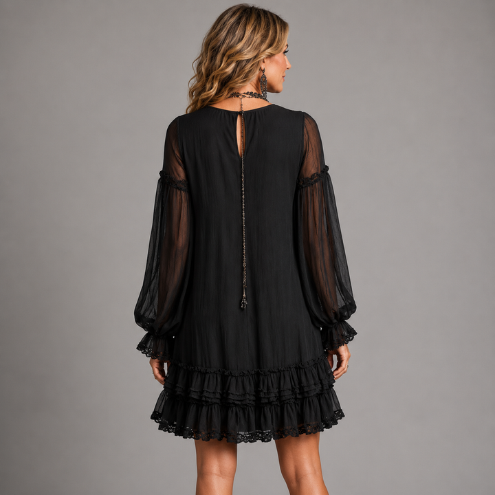 Nadine short dress back view showing fabric drape