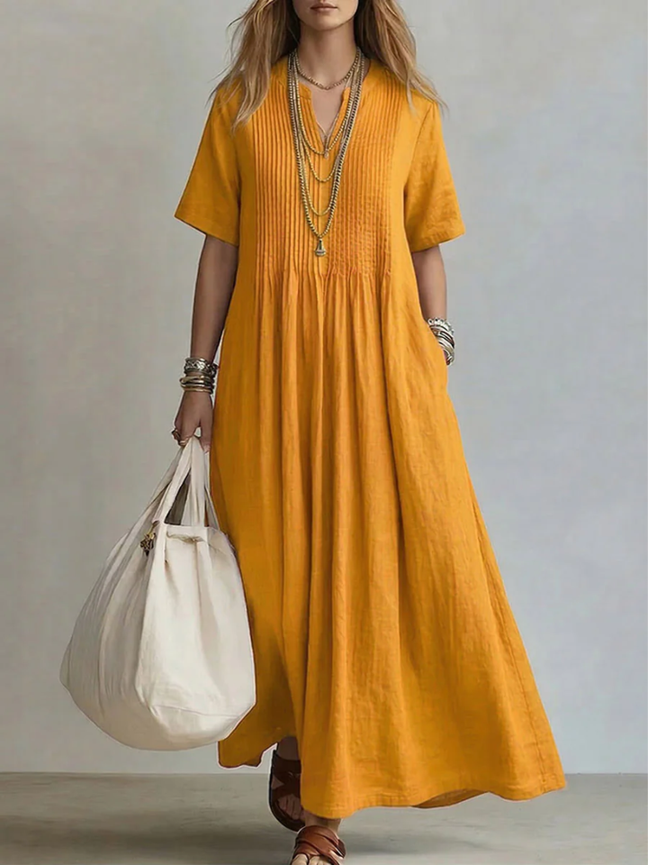 Irene pleated cotton maxi dress in saffron yellow